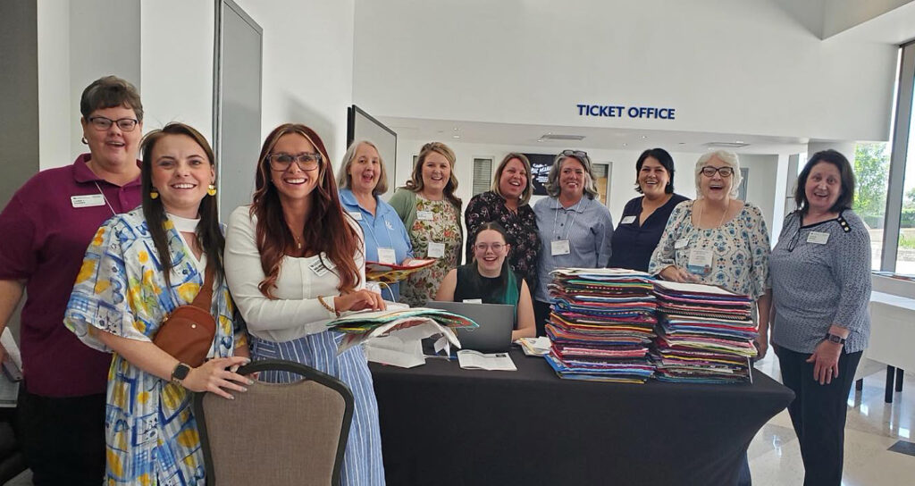 FCS Agents and homemaker leaders organize 308 handmade quilt squares for the 2026 Quilt Square Auction.